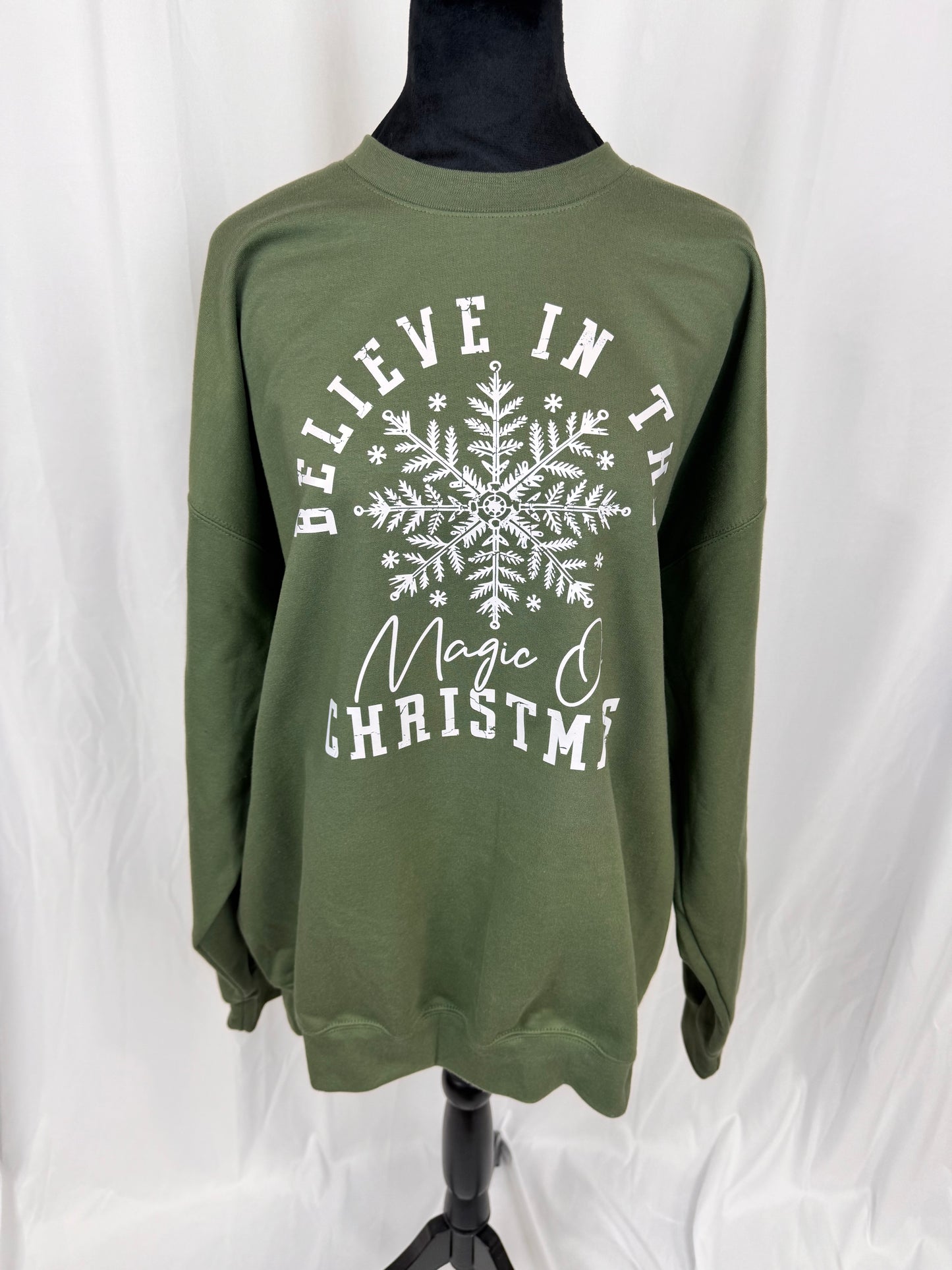 Believe In The Magic Of Christmas Cozy Sweatshirt: Military Green Crew Neck Sweatshirt