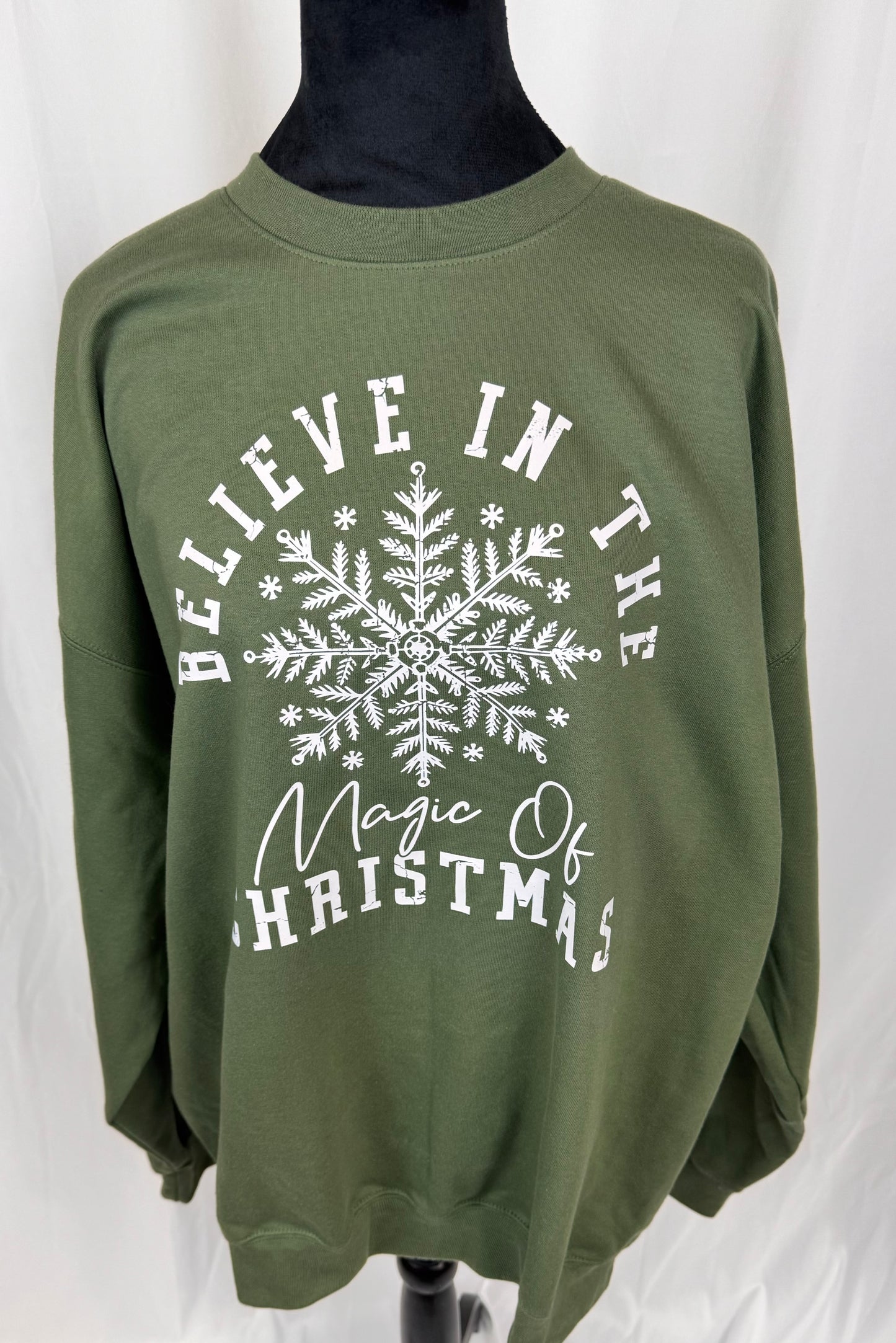 Believe In The Magic Of Christmas Cozy Sweatshirt: Military Green Crew Neck Sweatshirt