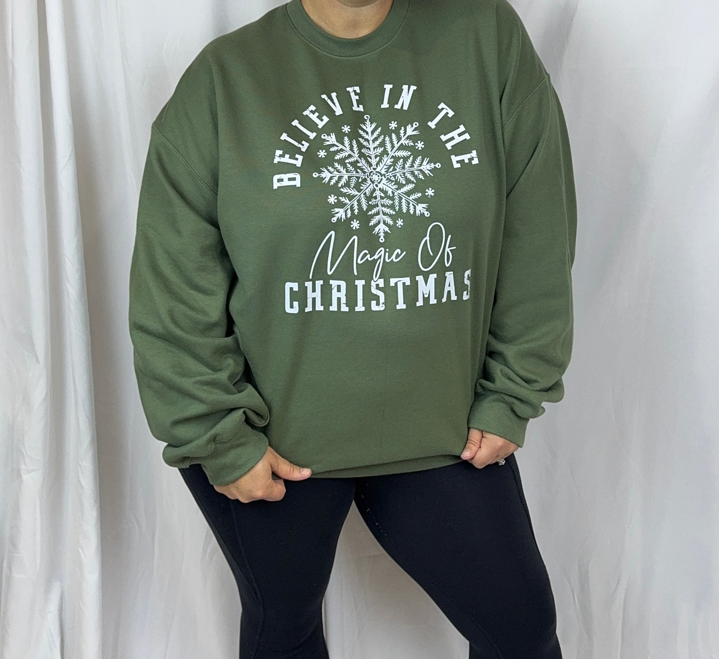 Believe In The Magic Of Christmas Cozy Sweatshirt: Military Green Crew Neck Sweatshirt