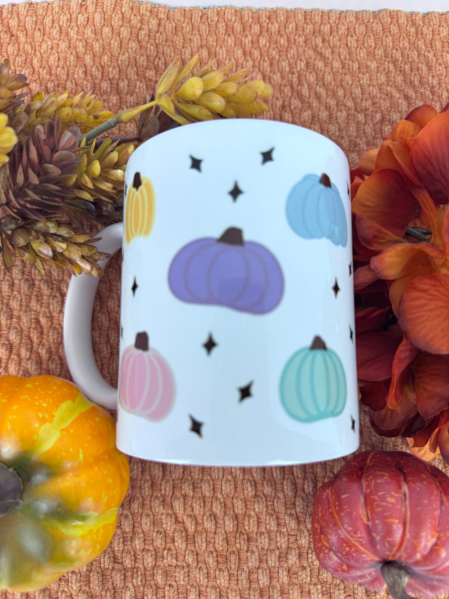 White 11 oz coffee mug with hand drawn pastel pumpkin pattern