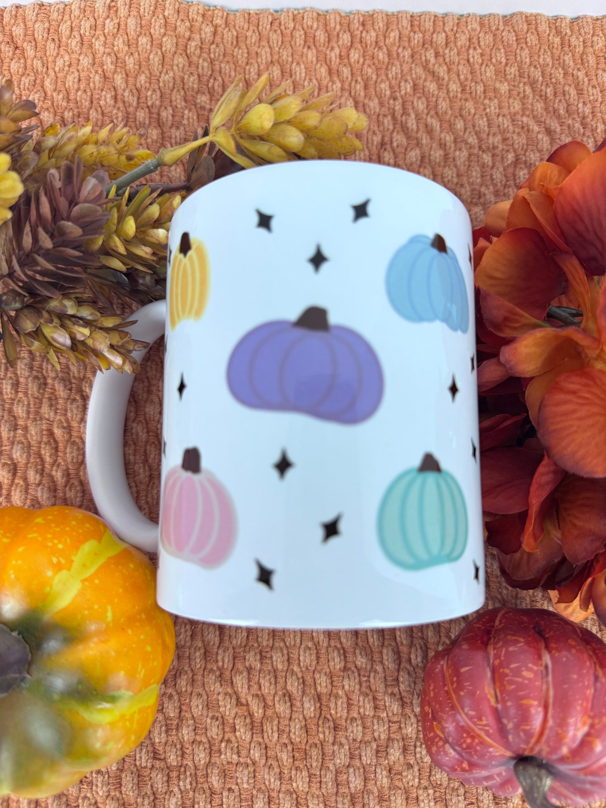 White 11 oz coffee mug with hand drawn pastel pumpkin pattern