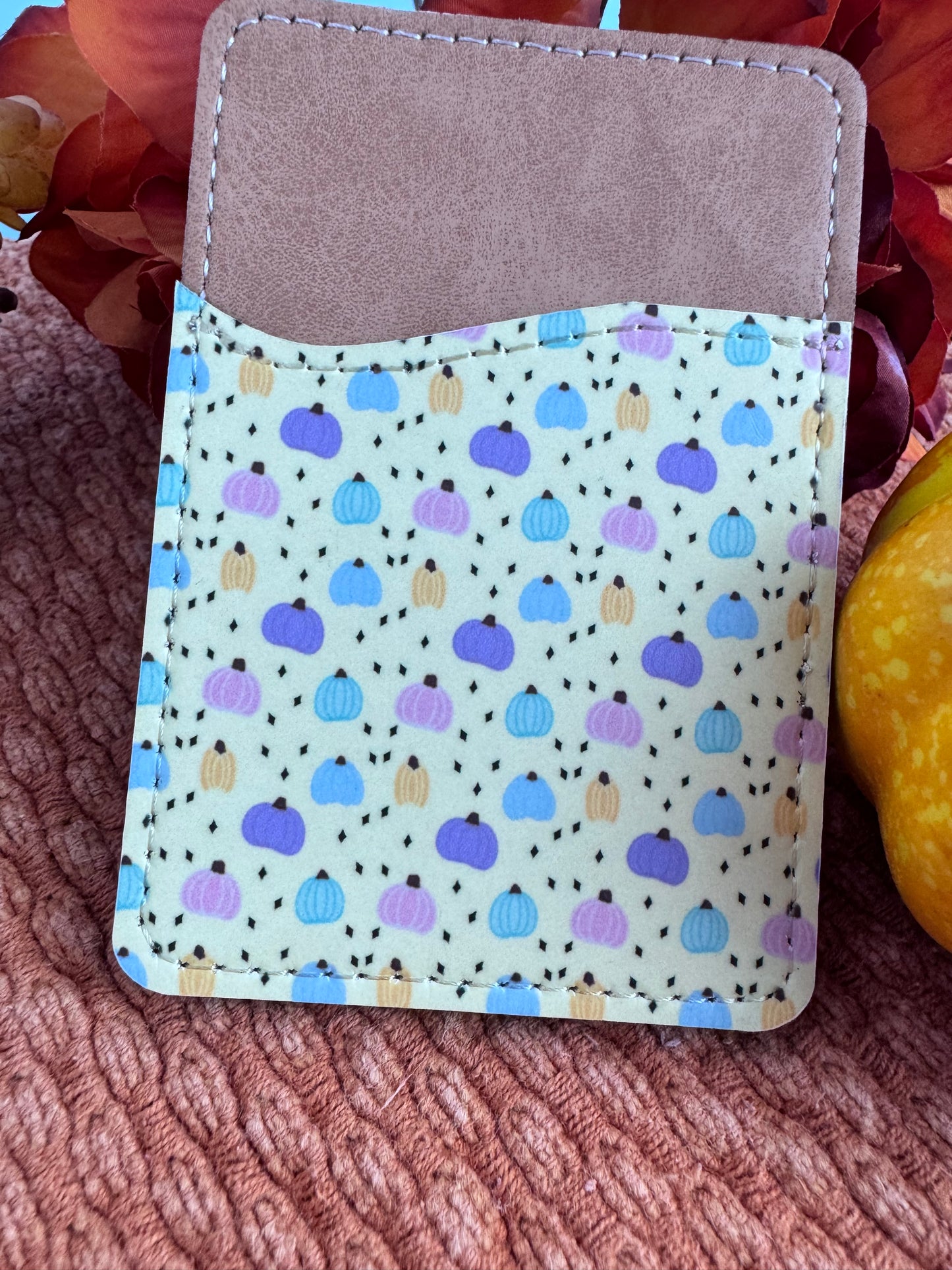 Close-up of pastel pumpkin design printed on faux leather