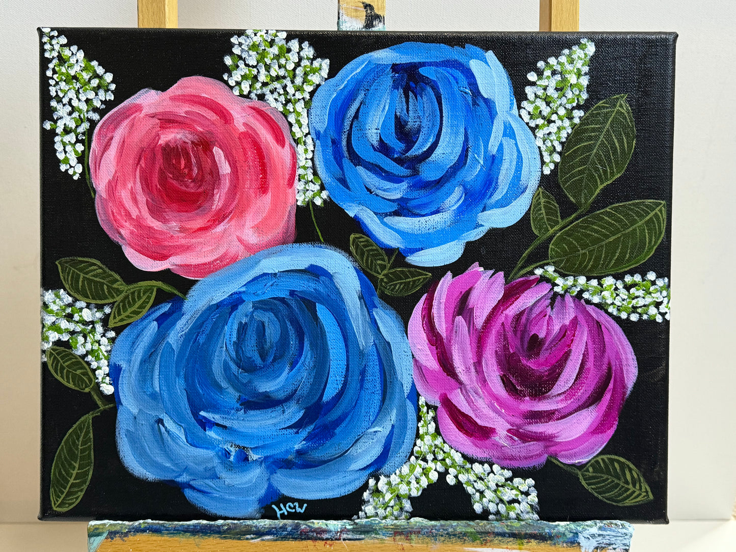 Impressionist Rose Painting in Acrylic. Black background with 2 blue, 1 red, 1 pink rose. 14x11 inches unframed, stretched canvas.