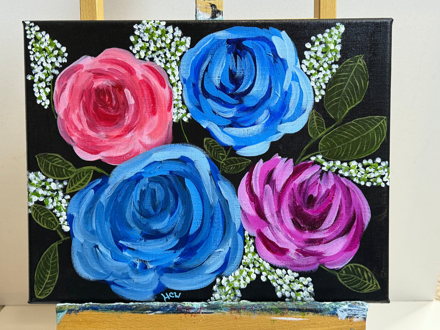 Impressionist Rose Painting in Acrylic. Black background with 2 blue, 1 red, 1 pink rose. 14x11 inches unframed, stretched canvas.