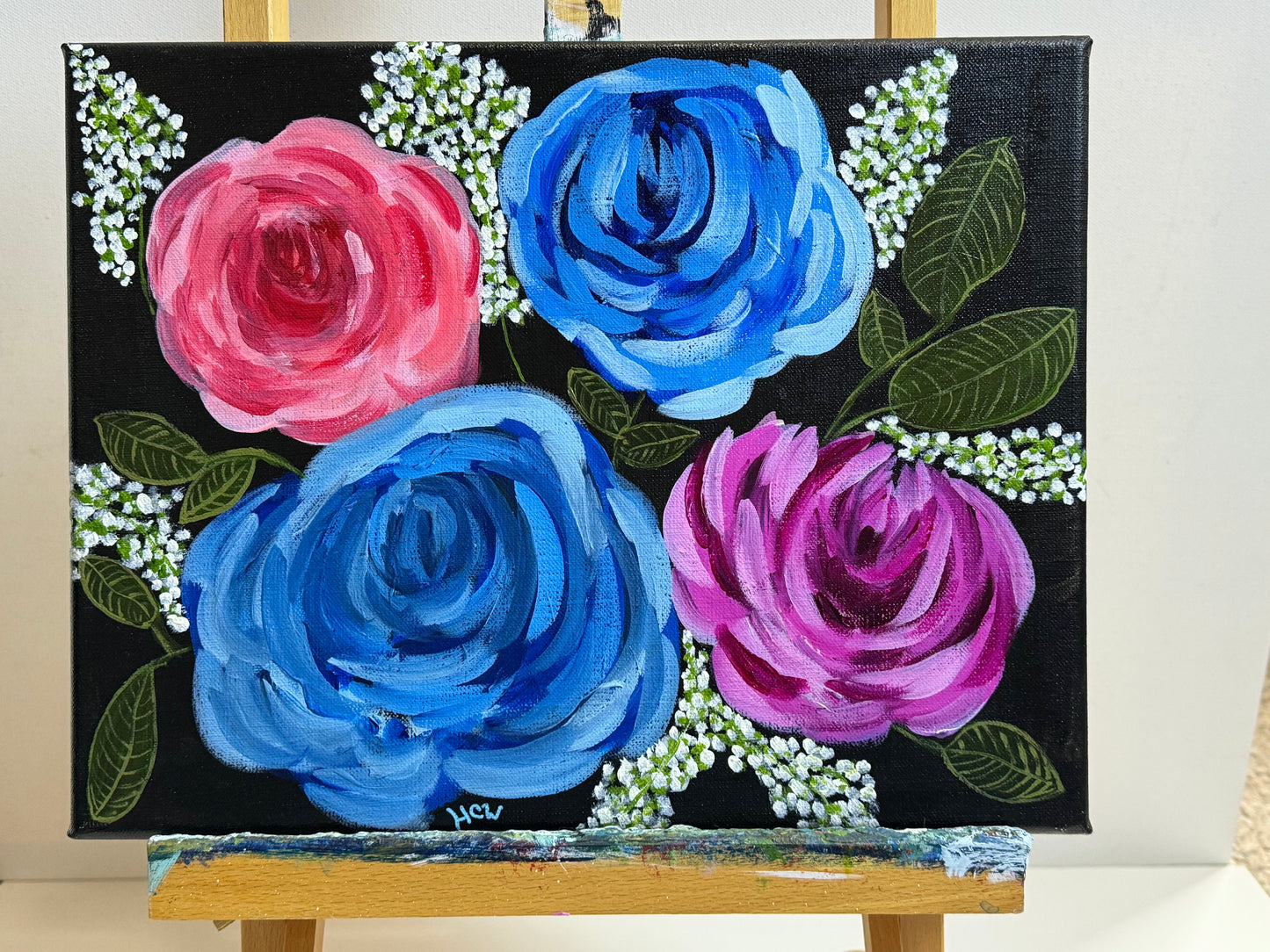 Impressionist Rose Painting in Acrylic. Black background with 2 blue, 1 red, 1 pink rose. 14x11 inches unframed, stretched canvas.