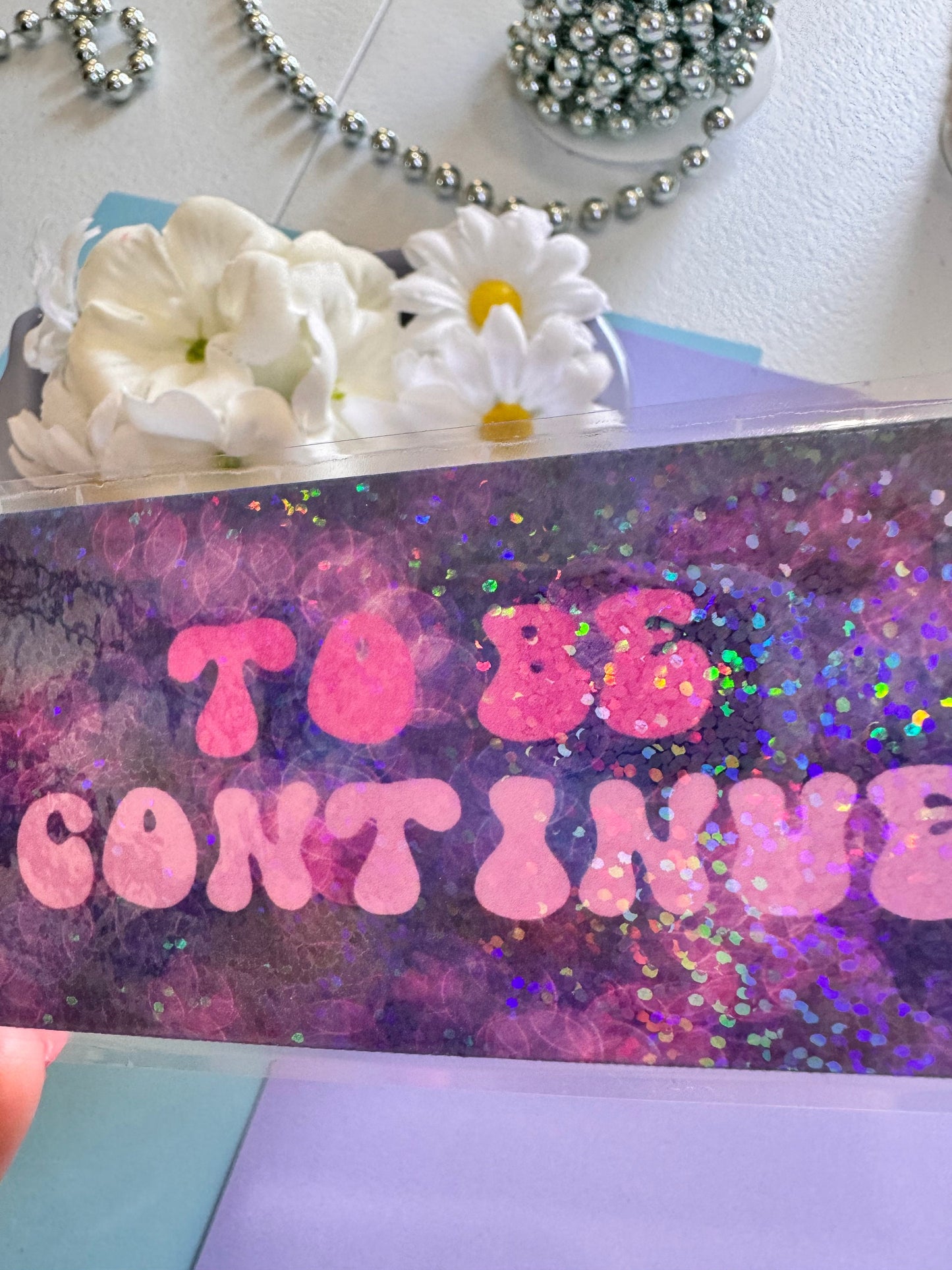 To Be Continued Holographic Laminated Bookmark